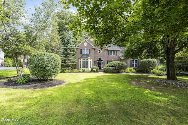 222 Bell Ct, Guilderland, NY 12303 - colonial home with a front lawn and brick siding