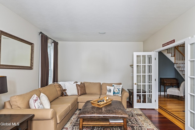 222 Bell Ct, Guilderland, NY 12303 - living area featuring dark wood-style floors, french doors, and stairway