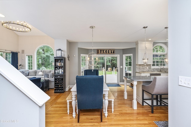 222 Bell Ct, Guilderland, NY 12303 - dining room featuring a chandelier and light wood finished floors