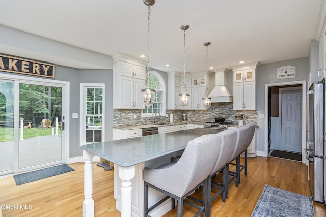 222 Bell Ct, Guilderland, NY 12303 - kitchen featuring custom range hood, stainless steel appliances, decorative backsplash, white cabinetry, and recessed lighting