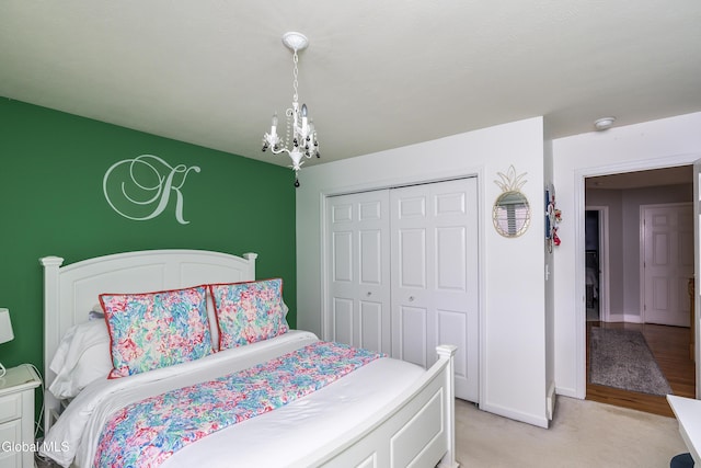 222 Bell Ct, Guilderland, NY 12303 - bedroom with a chandelier, a closet, and light carpet