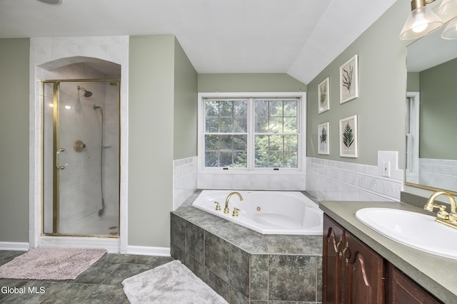 222 Bell Ct, Guilderland, NY 12303 - full bathroom featuring vanity, a jetted tub, a shower stall, and vaulted ceiling