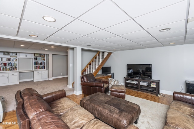 222 Bell Ct, Guilderland, NY 12303 - living area featuring stairway, wood finished floors, a paneled ceiling, and recessed lighting