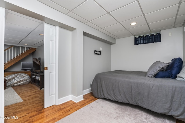 222 Bell Ct, Guilderland, NY 12303 - bedroom featuring a paneled ceiling, wood finished floors, and recessed lighting