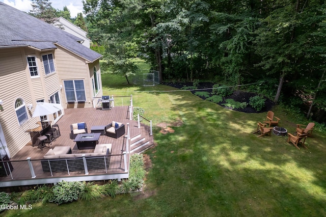 222 Bell Ct, Guilderland, NY 12303 - view of grassy yard with a wooden deck and an outdoor living space with a fire pit