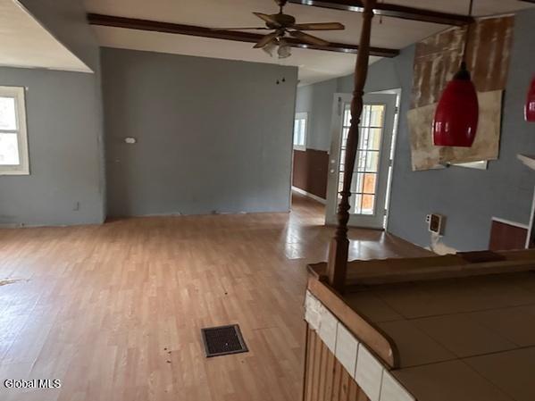 873 W Fulton Rd, Fulton, NY 12187 - living room featuring a ceiling fan and wood finished floors