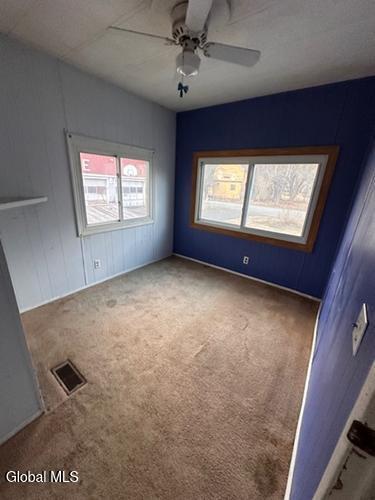 873 W Fulton Rd, Fulton, NY 12187 - unfurnished room featuring a ceiling fan and carpet