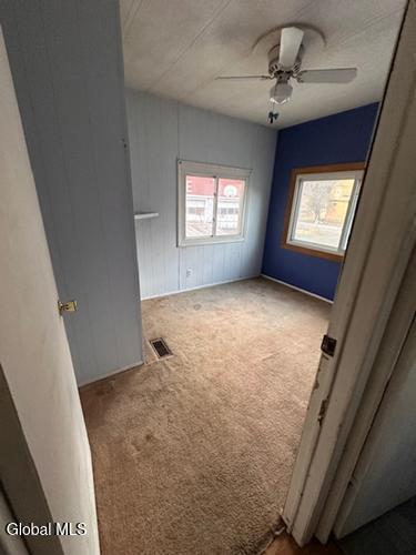 873 W Fulton Rd, Fulton, NY 12187 - carpeted spare room with a ceiling fan