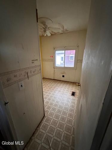 873 W Fulton Rd, Fulton, NY 12187 - laundry area with light flooring and a ceiling fan