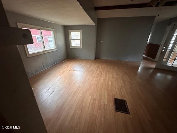 873 W Fulton Rd, Fulton, NY 12187 - unfurnished room featuring wood finished floors
