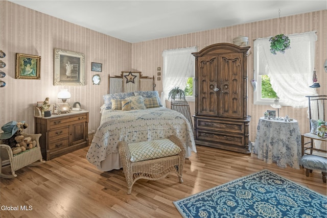 12 Jean Pl, Guilderland, NY 12303 - bedroom featuring wallpapered walls, multiple windows, and light wood-style flooring