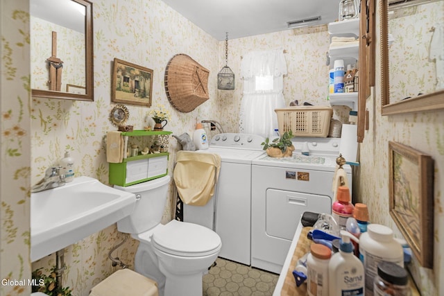 12 Jean Pl, Guilderland, NY 12303 - half bath with washing machine and clothes dryer and wallpapered walls