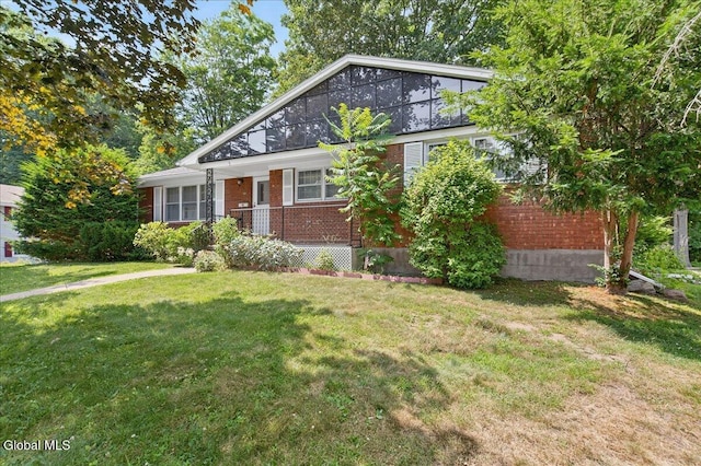 3 Roberts Ln, Saratoga Springs, Inside, NY 12866 - view of front of home featuring brick siding and a front lawn