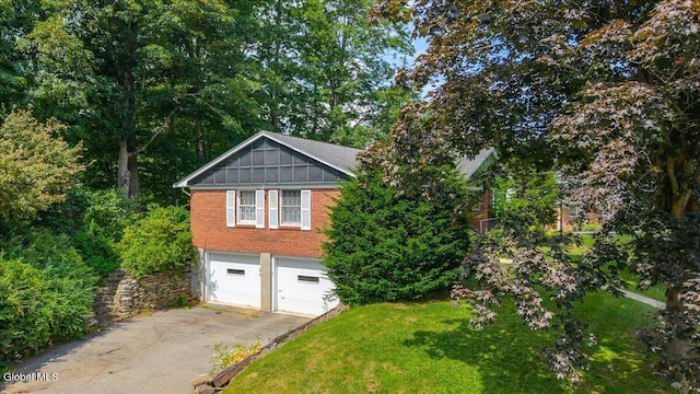 3 Roberts Ln, Saratoga Springs, Inside, NY 12866 - view of home's exterior with a garage, brick siding, asphalt driveway, and a lawn