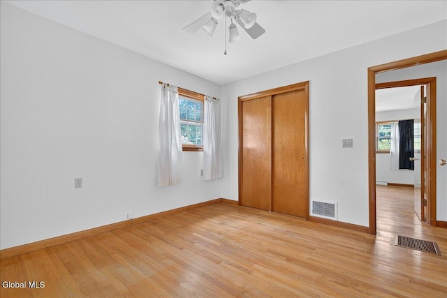 3 Roberts Ln, Saratoga Springs, Inside, NY 12866 - unfurnished bedroom with multiple windows, light wood finished floors, a closet, and ceiling fan
