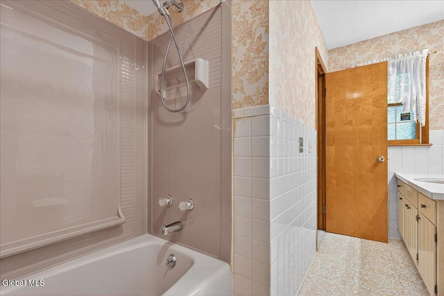 3 Roberts Ln, Saratoga Springs, Inside, NY 12866 - bathroom with wallpapered walls, tile walls, shower / bathtub combination, vanity, and wainscoting