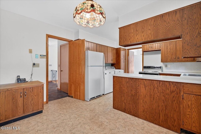 3 Roberts Ln, Saratoga Springs, Inside, NY 12866 - kitchen featuring freestanding refrigerator, washing machine and clothes dryer, electric range oven, light carpet, and brown cabinetry