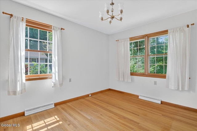3 Roberts Ln, Saratoga Springs, Inside, NY 12866 - unfurnished room with plenty of natural light, a baseboard radiator, a chandelier, and light wood-style flooring