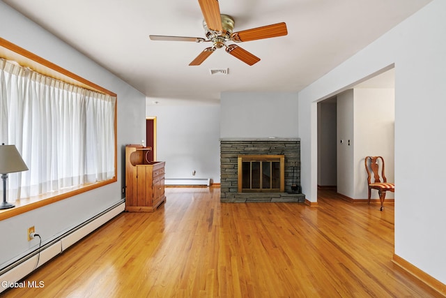 2351 Oakland Ave, Schenectady, NY 12309 - unfurnished living room with baseboard heating, light wood-style flooring, ceiling fan, and a fireplace