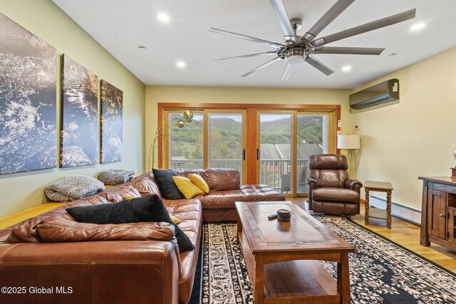 35 Scribner Hollow Rd # E3, Hunter, NY 12442 - living area with a wall mounted AC, baseboard heating, ceiling fan, recessed lighting, and light wood-style flooring