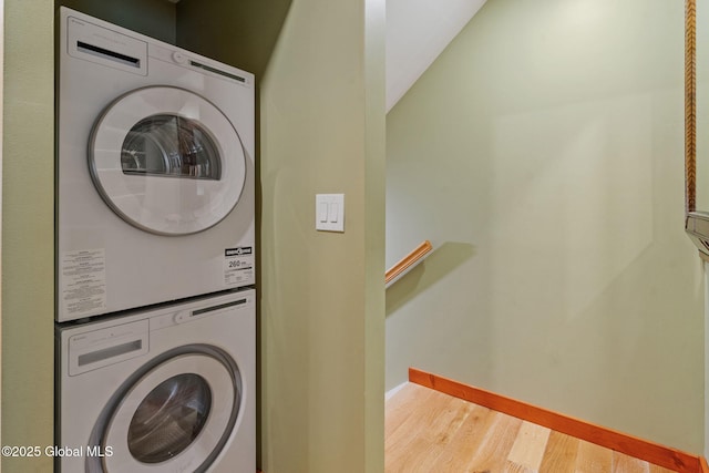 35 Scribner Hollow Rd # E3, Hunter, NY 12442 - washroom with stacked washer / drying machine and wood finished floors