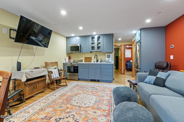 35 Scribner Hollow Rd # E3, Hunter, NY 12442 - living area featuring light wood-type flooring, bar with sink, and recessed lighting