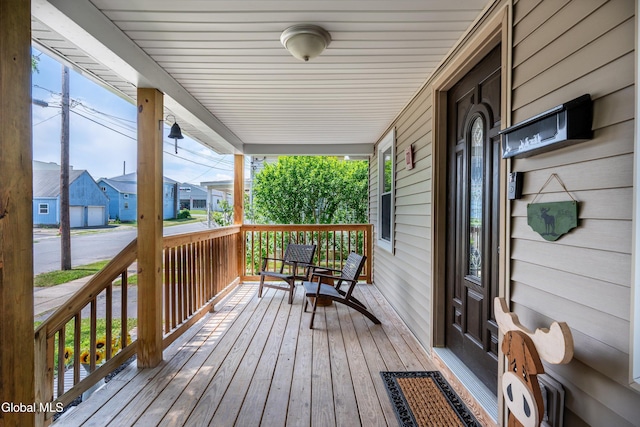 10 3rd St, South Glens Falls, NY 12803 - wooden porch with a residential view