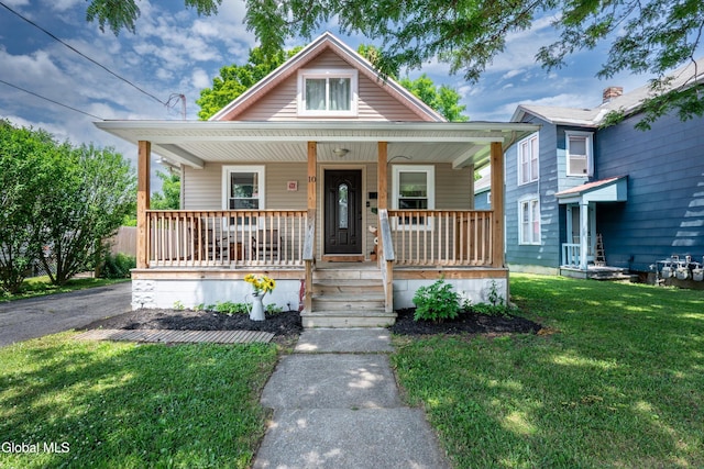 10 3rd St, South Glens Falls, NY 12803 - bungalow featuring a front yard and a porch