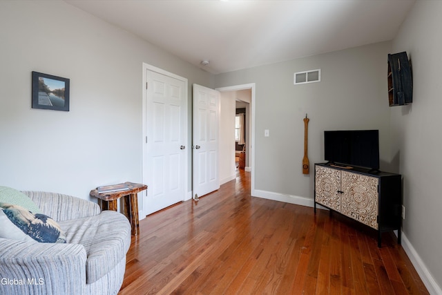 10 3rd St, South Glens Falls, NY 12803 - living area featuring wood-type flooring and baseboards