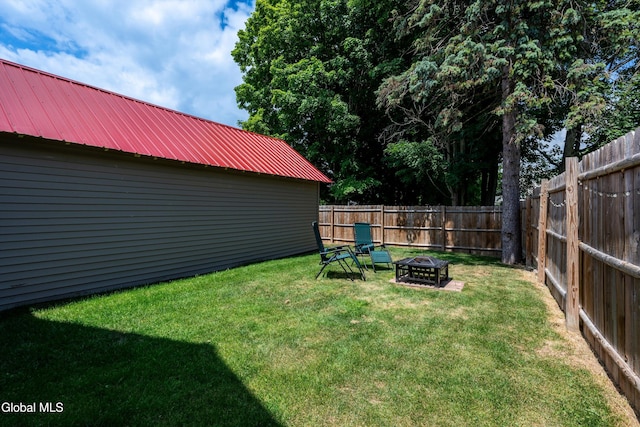 10 3rd St, South Glens Falls, NY 12803 - fenced backyard featuring an outdoor fire pit