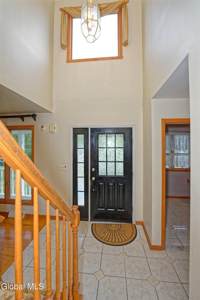 33 Cindy Ln, Halfmoon, NY 12065 - foyer featuring healthy amount of natural light, light tile patterned floors, and a towering ceiling