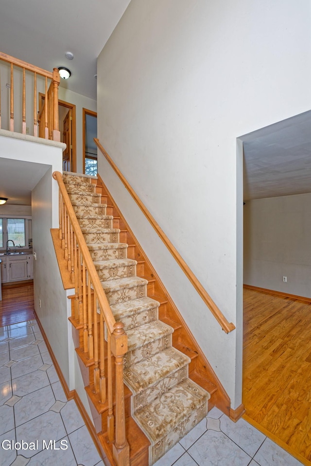 33 Cindy Ln, Halfmoon, NY 12065 - staircase featuring baseboards and tile patterned flooring