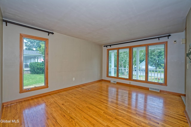 33 Cindy Ln, Halfmoon, NY 12065 - empty room featuring wood finished floors and baseboards