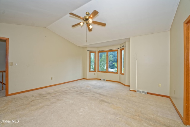 33 Cindy Ln, Halfmoon, NY 12065 - unfurnished room with light colored carpet, lofted ceiling, and a ceiling fan