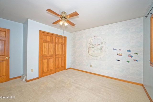 33 Cindy Ln, Halfmoon, NY 12065 - unfurnished bedroom featuring light colored carpet, a closet, and ceiling fan