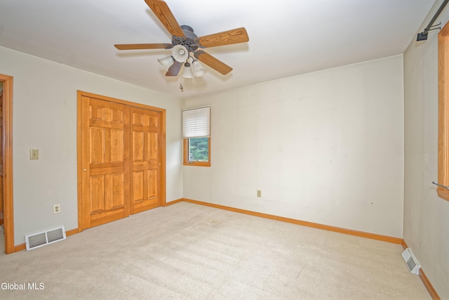 33 Cindy Ln, Halfmoon, NY 12065 - unfurnished bedroom with carpet flooring, a closet, and a ceiling fan