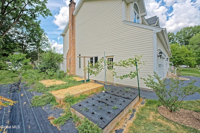 33 Cindy Ln, Halfmoon, NY 12065 - view of property exterior with a garage