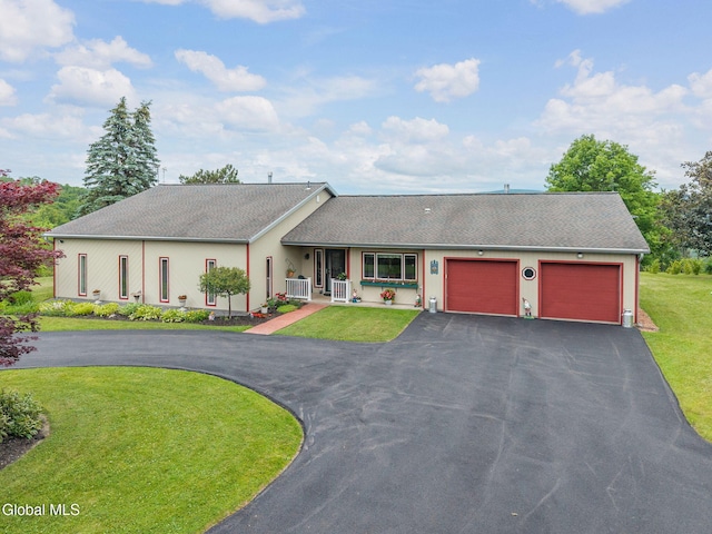 271 Settles Mountain Rd, Cobleskill, NY 12043 - single story home with driveway, covered porch, an attached garage, a front yard, and a shingled roof