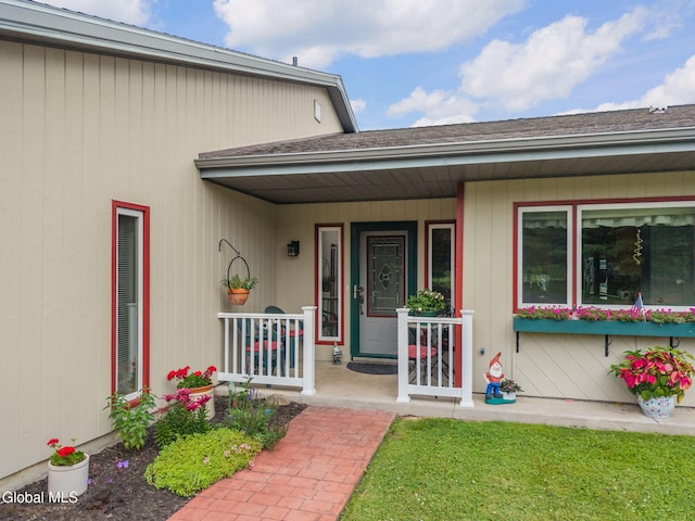 271 Settles Mountain Rd, Cobleskill, NY 12043 - property entrance with a porch and roof with shingles