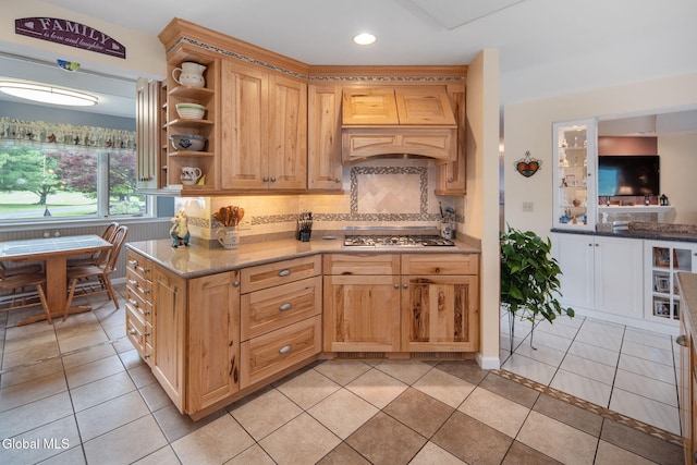 271 Settles Mountain Rd, Cobleskill, NY 12043 - kitchen with custom exhaust hood, stainless steel gas cooktop, decorative backsplash, light tile patterned floors, and open shelves