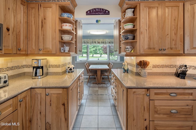 271 Settles Mountain Rd, Cobleskill, NY 12043 - kitchen with open shelves, tasteful backsplash, light stone counters, and light tile patterned floors