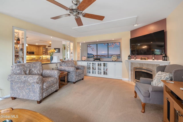 271 Settles Mountain Rd, Cobleskill, NY 12043 - living area featuring light carpet, a ceiling fan, and a tile fireplace