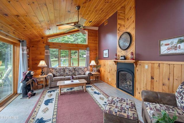 271 Settles Mountain Rd, Cobleskill, NY 12043 - tiled living area with wood walls, lofted ceiling, wooden ceiling, a fireplace, and wainscoting