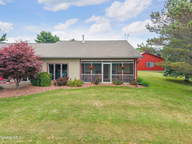 271 Settles Mountain Rd, Cobleskill, NY 12043 - back of house featuring a sunroom, a lawn, and roof with shingles