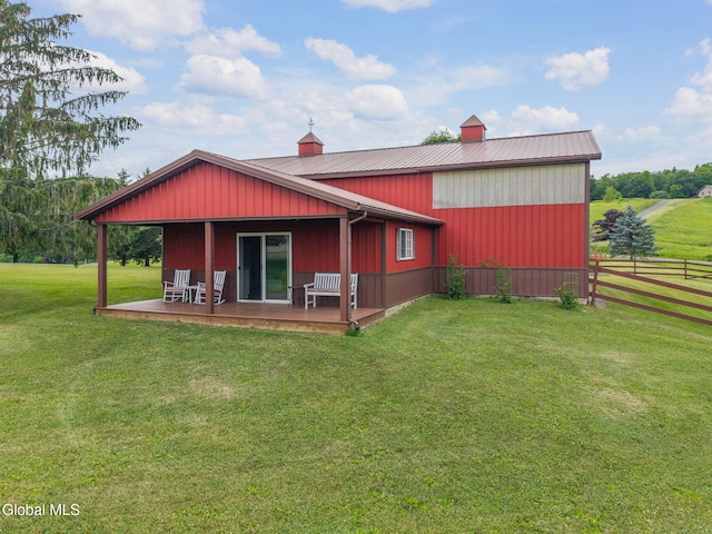 271 Settles Mountain Rd, Cobleskill, NY 12043 - back of property with a metal roof and a chimney