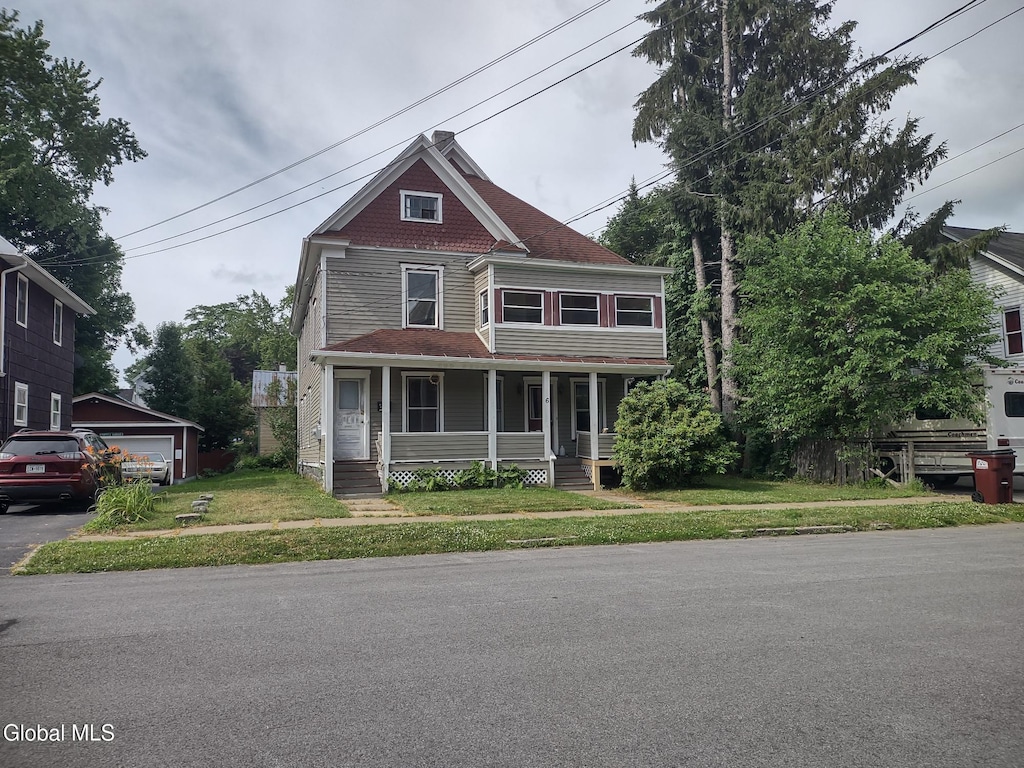 6 7th Ave, Gloversville, NY 12078 - victorian home featuring covered porch and a front yard