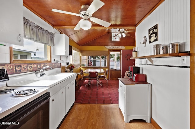 15 Fathom Dr, Stillwater, NY 12866 - kitchen with range with electric stovetop, white cabinets, a ceiling fan, light wood-style floors, and vaulted ceiling