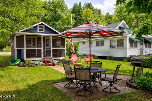 15 Fathom Dr, Stillwater, NY 12866 - rear view of property with a sunroom, a lawn, and outdoor dining space