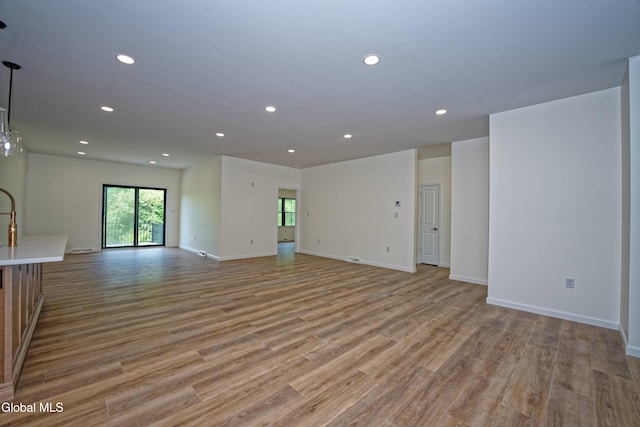 145C Bozenkill Rd, Altamont, NY 12009 - unfurnished living room with light wood-type flooring and recessed lighting