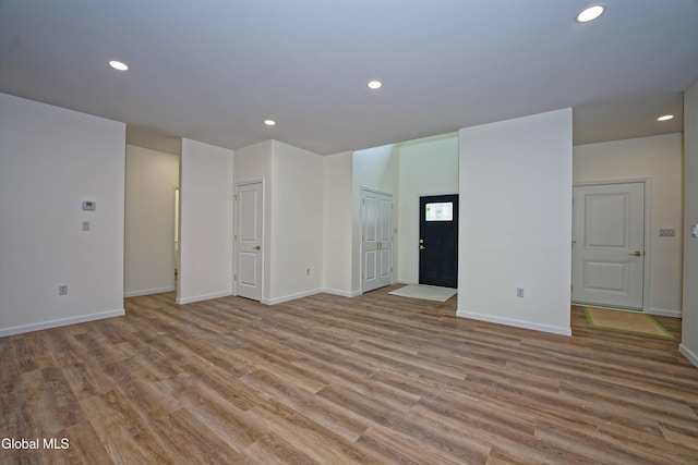 145C Bozenkill Rd, Altamont, NY 12009 - unfurnished living room featuring wood finished floors and recessed lighting